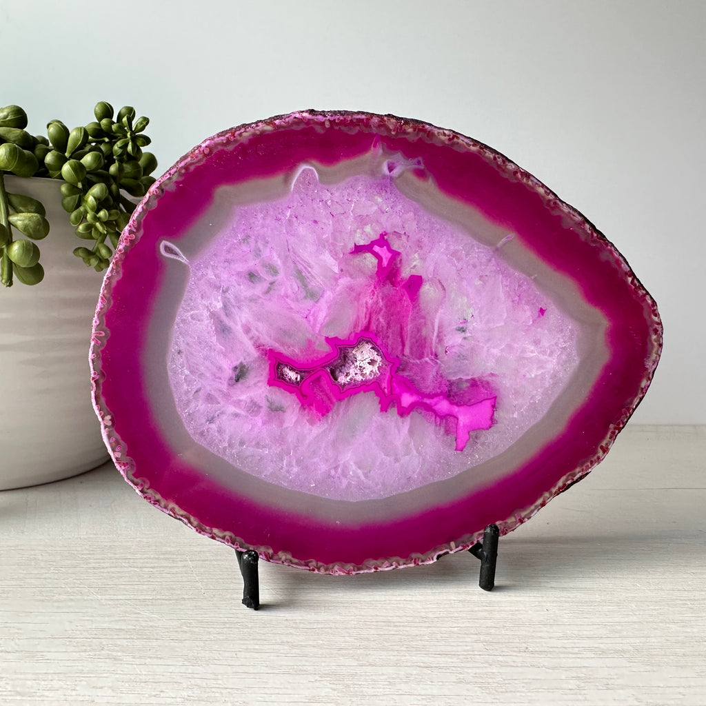 pink agate slab on metal stand