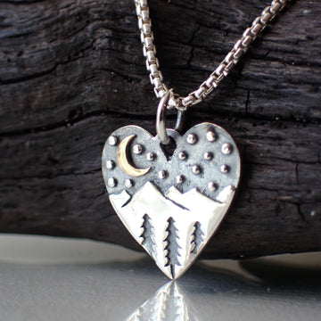 Sterling silver heart pendant with pine trees, mountains, crescent moon and stars made from Recycled Silver