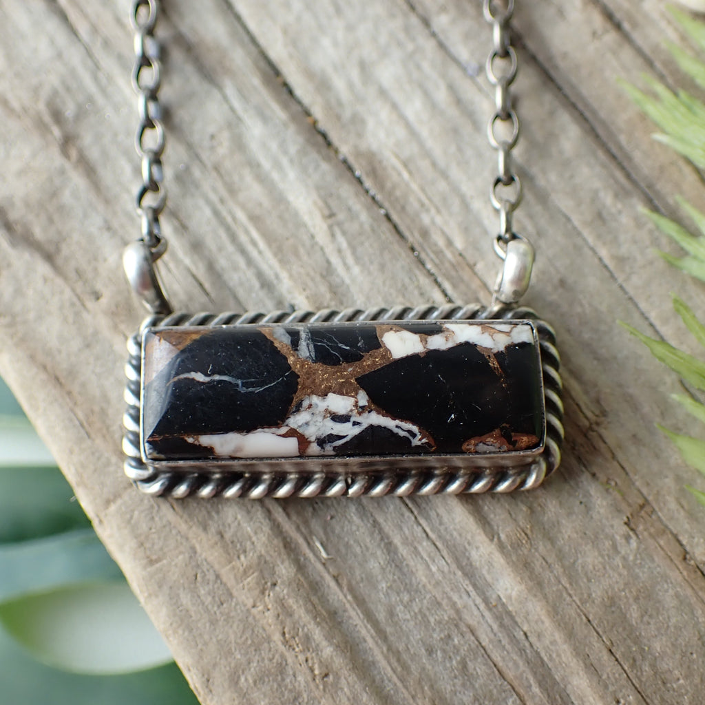 sterling silver white black and copper bar necklace on driftwood